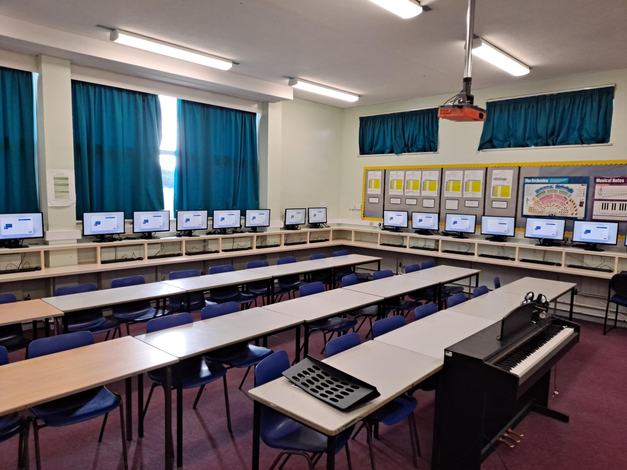ICT classroom with rows of computers and keyboards, emphasising digital learning in Penk Valley schools.