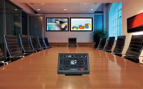 Modern conference room with a large table and screen, representing trustee meeting attendance for Penk Valley Academy Trust.